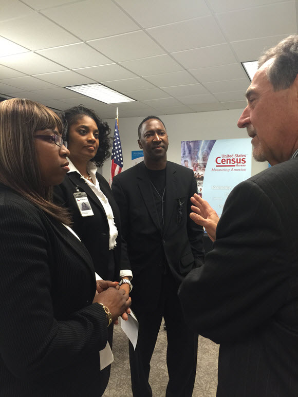 Director Thompson talks with Khalilat Adesokan, Tonya Netters and Fred Darden of Goodwill Industries of Houston